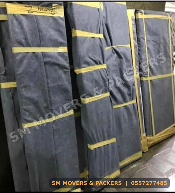 Panels wrapped in moving blankets