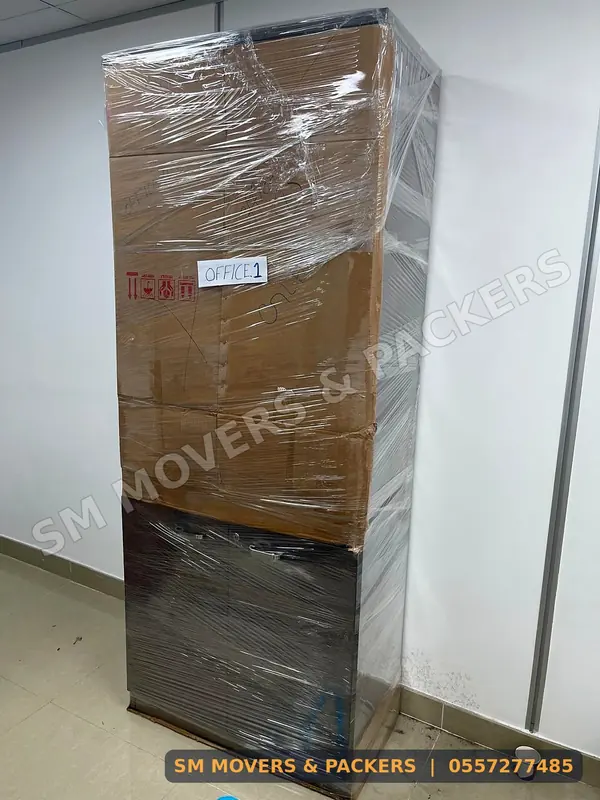 Tall cabinet packed in cartons and film