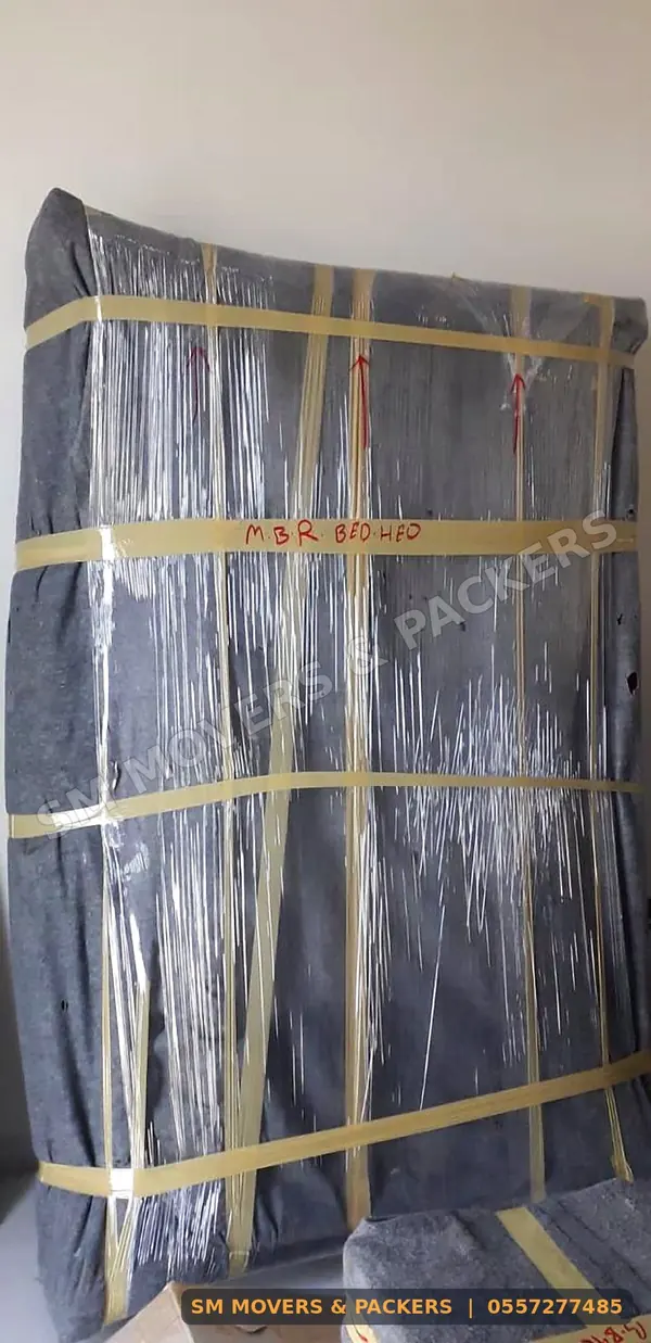 Wardrobe wrapped in blankets